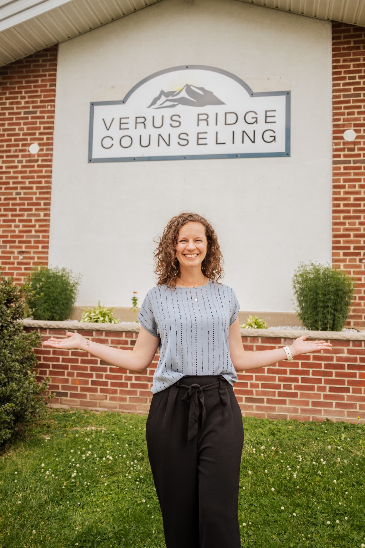 Veronica standing outside the Verus Ridge Counseling office